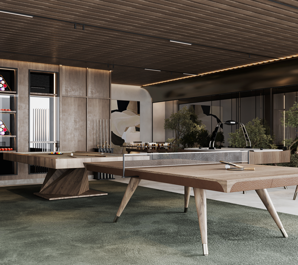 Stylish game room inside Aveline Building featuring a ping pong table and diverse game tables in a warm wooden ambiance